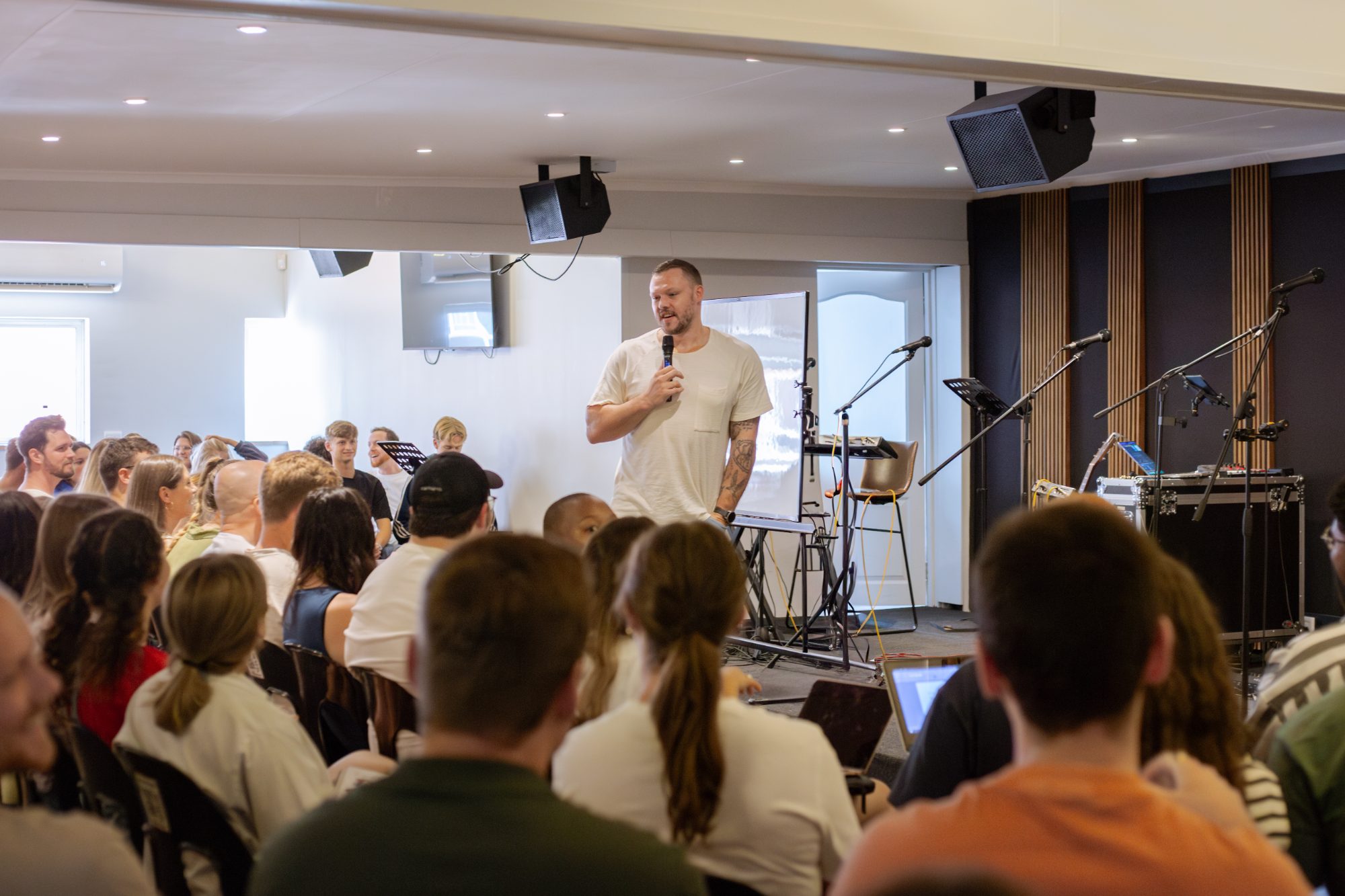 Teaching the Word to a seated MissioSA gathering